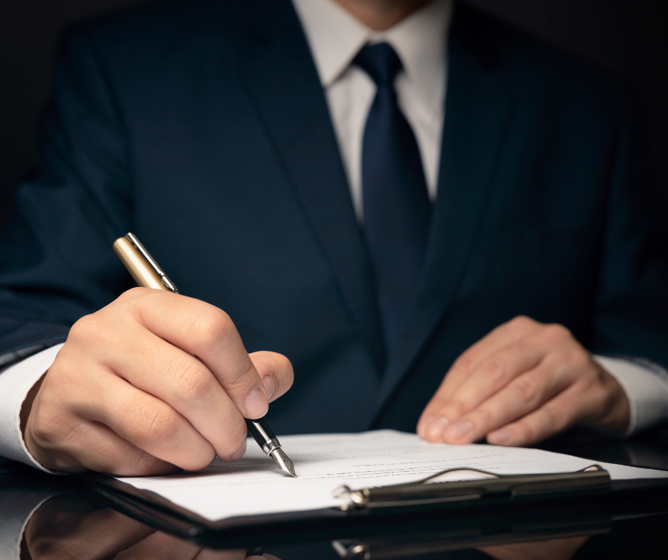 Obraz przedstawiaj�cy m�czyzn� podpisuj�cego dokumenty